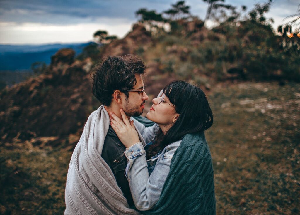 Woman Sharing Blanket With Man